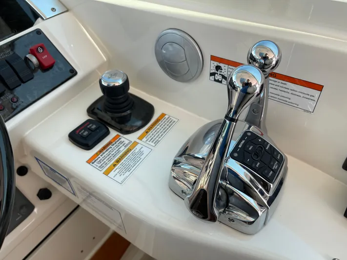  Yacht Photos Pics Control panel of 2012 Sea Ray 450 Sundancer boat with throttle and joystick.