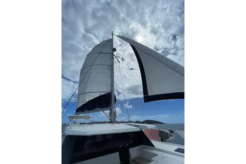  Yacht Photos Pics Sailing on a 2019 Leopard 45 catamaran under cloudy skies.