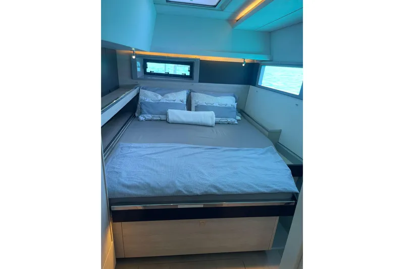  Yacht Photos Pics Luxurious bedroom interior of 2019 Leopard 45 yacht with modern design and ocean view.