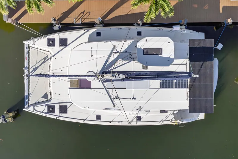  Yacht Photos Pics Aerial view of 2019 Leopard 45 catamaran docked, showcasing solar panels and sleek design.