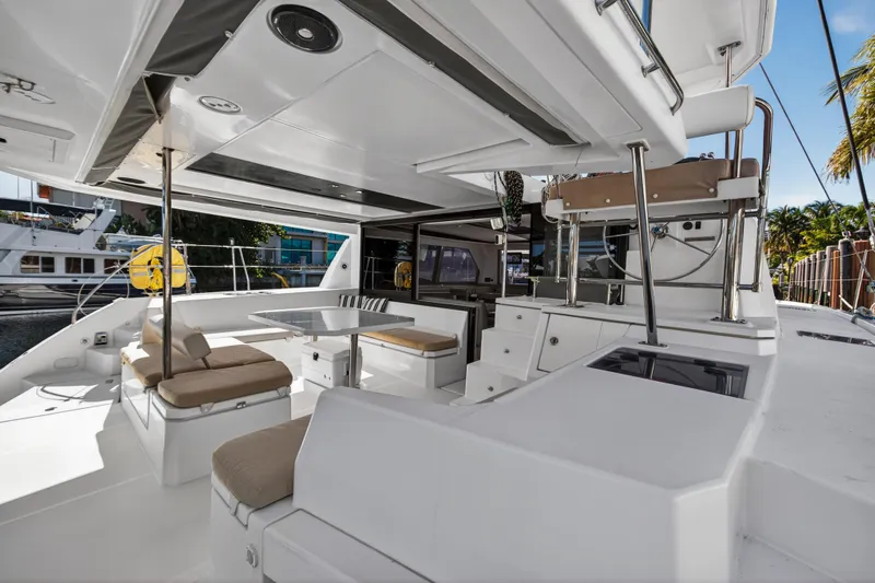  Yacht Photos Pics Spacious deck of 2019 Leopard 45 catamaran with seating and dining area.