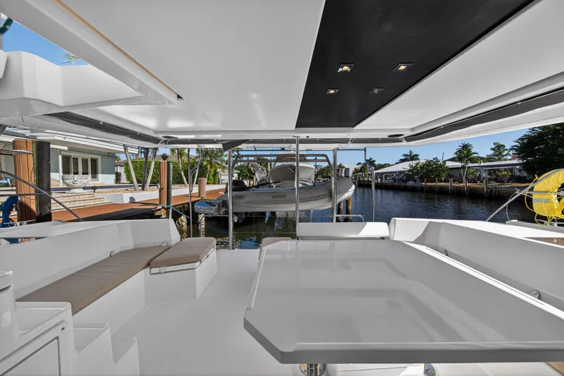  Yacht Photos Pics 2019 Leopard 45 yacht interior with spacious seating and waterfront view.