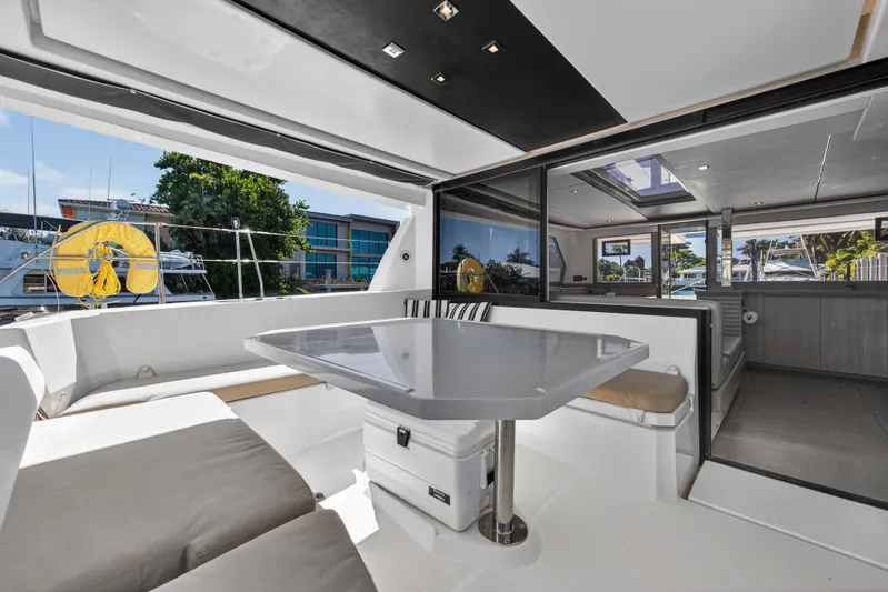  Yacht Photos Pics Luxurious 2019 Leopard 45 catamaran interior with modern seating and dining area.