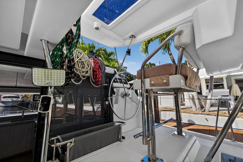  Yacht Photos Pics Interior view of 2019 Leopard 45 catamaran helm with ropes and seating.
