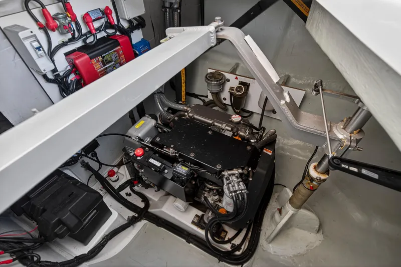  Yacht Photos Pics Engine room of a 2019 Leopard 45 catamaran, showcasing mechanical components and wiring.