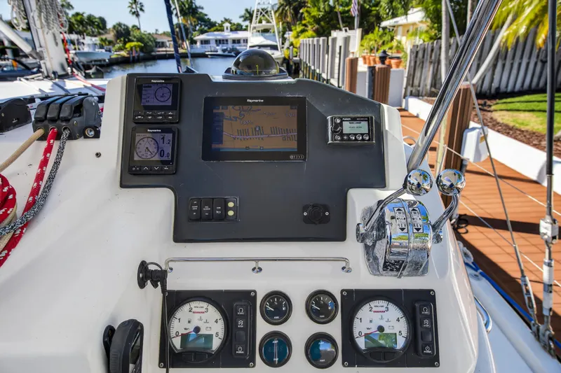  Yacht Photos Pics Control panel of a 2019 Leopard 45 yacht with navigation instruments and throttle levers.