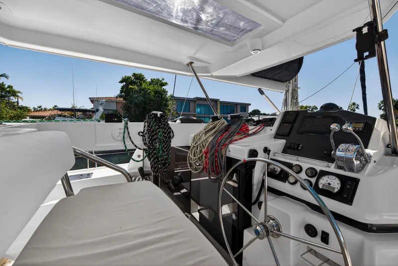  Yacht Photos Pics Helm of 2019 Leopard 45 catamaran with steering wheel and navigation controls.