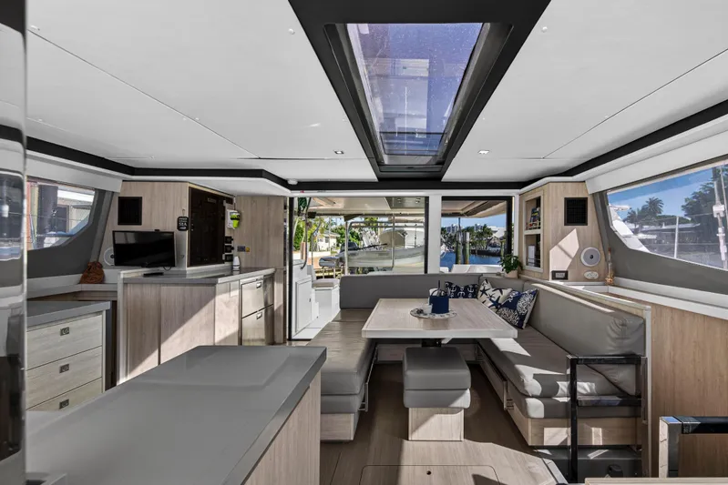  Yacht Photos Pics Luxurious interior of 2019 Leopard 45 catamaran with modern design and spacious seating area.