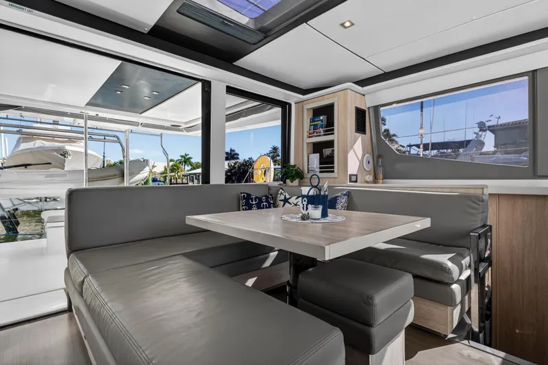  Yacht Photos Pics Luxurious interior of 2019 Leopard 45 yacht with modern seating and large windows.
