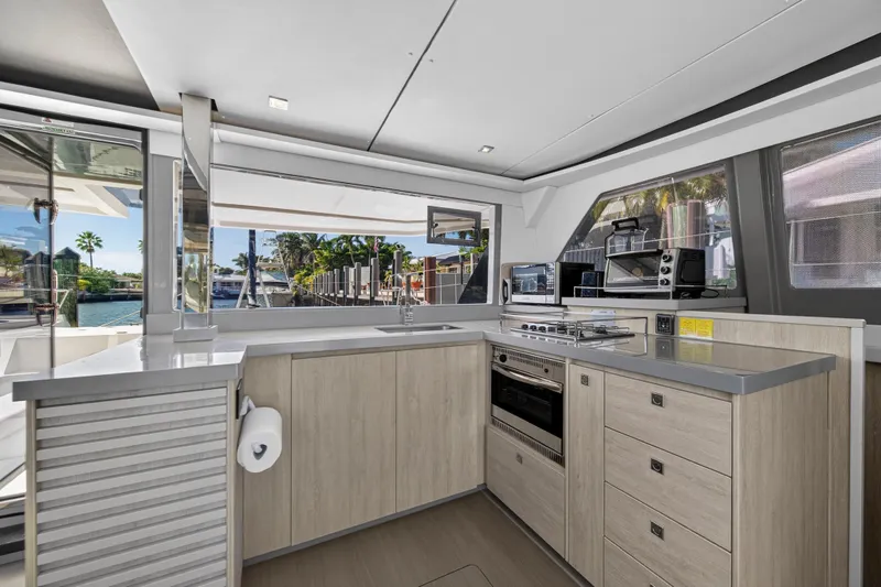  Yacht Photos Pics Modern kitchen interior on a 2019 Leopard 45 yacht, featuring sleek cabinetry and appliances.