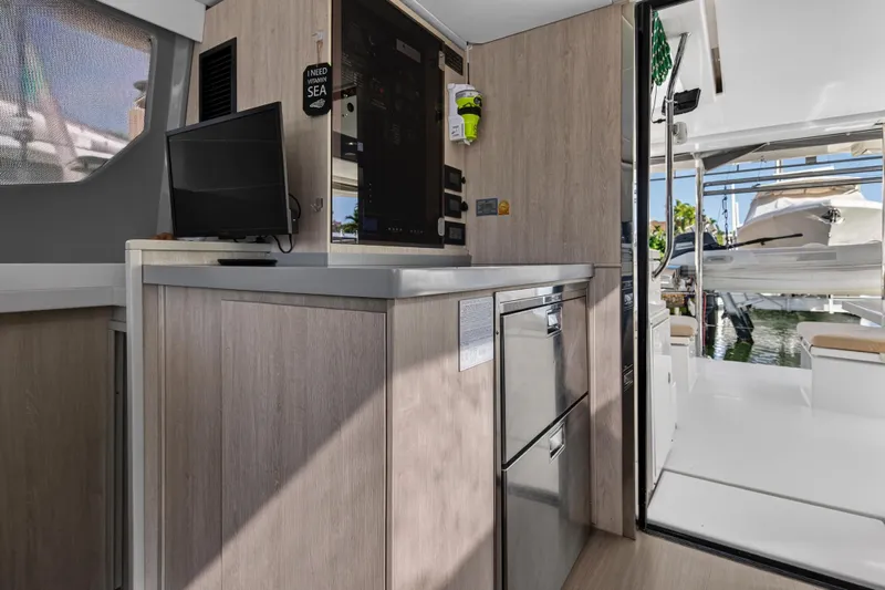  Yacht Photos Pics Interior of 2019 Leopard 45 yacht with modern kitchen and outdoor view.