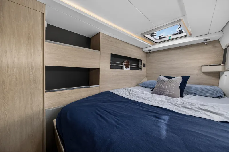  Yacht Photos Pics Luxurious bedroom interior of 2019 Leopard 45 yacht with skylight and modern design.