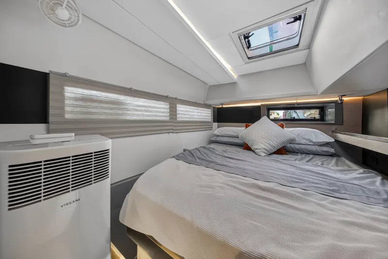  Yacht Photos Pics Luxurious cabin interior of 2019 Leopard 45 yacht with cozy bedding and modern design.