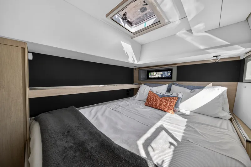  Yacht Photos Pics Luxurious bedroom interior of 2019 Leopard 45 yacht with skylight and modern decor.