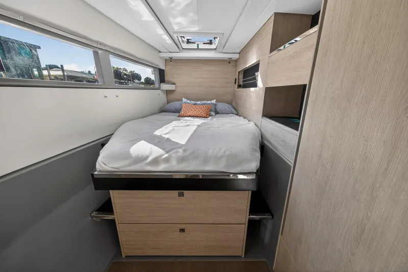  Yacht Photos Pics Luxurious cabin interior of 2019 Leopard 45 yacht with cozy bed and modern design.