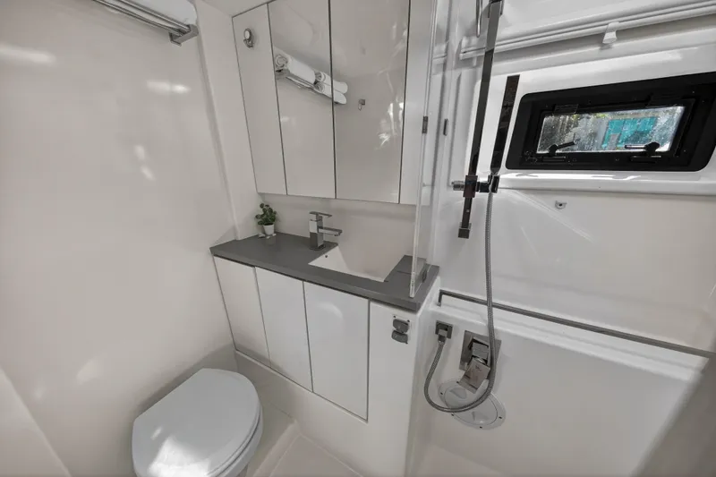  Yacht Photos Pics Modern bathroom in a 2019 Leopard 45 yacht, featuring sleek fixtures and a compact design.
