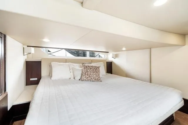 Horizen Yacht Photos Pics Luxurious bedroom interior of 2017 Regal 42 Grande Coupe yacht.