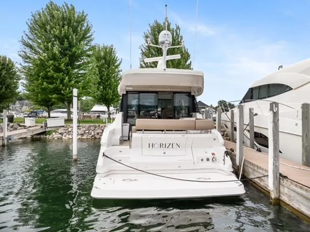 Horizen Yacht Photos Pics 2017 Regal 42 Grande Coupe yacht docked at marina, rear view.