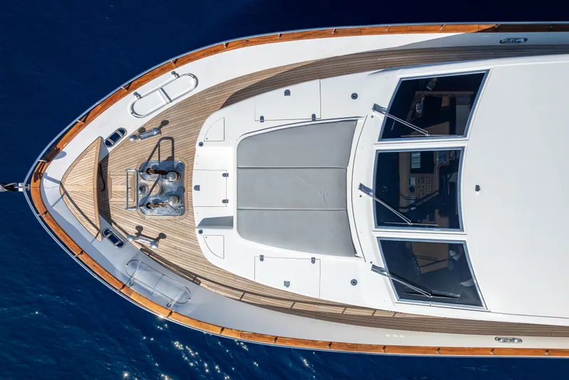  Yacht Photos Pics Aerial view of 1999 Falcon Yachts 86, showcasing sleek deck design and luxurious features.