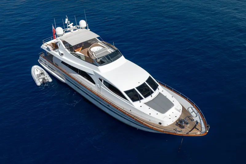  Yacht Photos Pics Luxurious 1999 Falcon Yachts 86 cruising on serene blue waters.