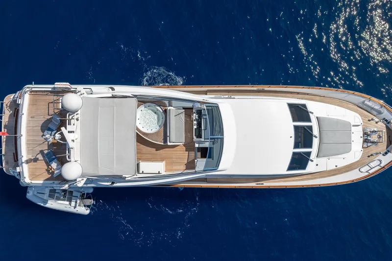  Yacht Photos Pics Overhead view of 1999 Falcon Yachts 86 on blue ocean water.