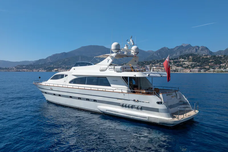  Yacht Photos Pics Luxurious 1999 Falcon Yachts 86 cruising on serene blue waters.