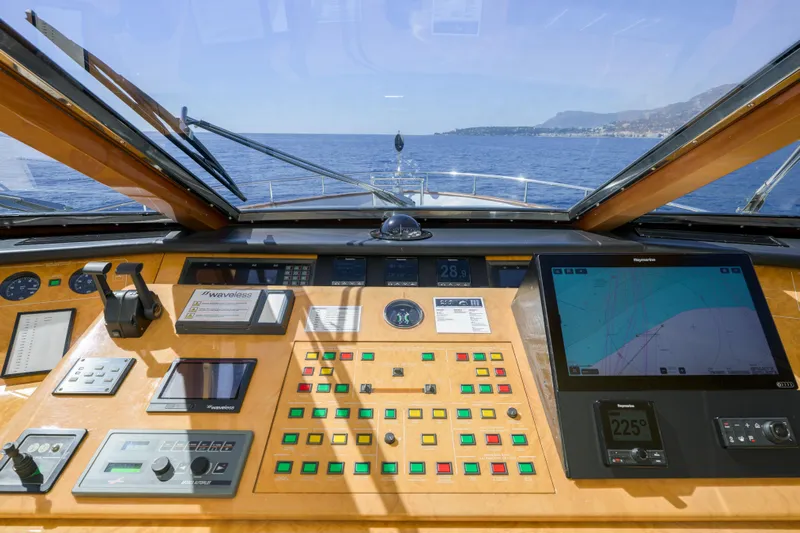  Yacht Photos Pics Cockpit view of 1999 Falcon Yachts 86, featuring navigation controls and sea view.