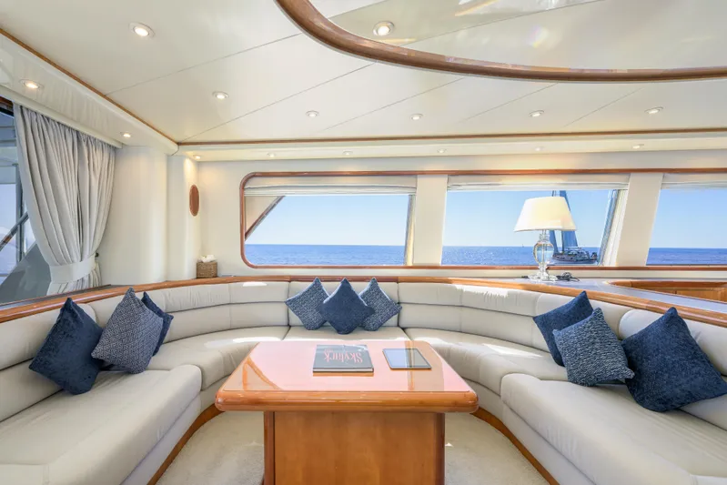  Yacht Photos Pics Luxurious interior of 1999 Falcon Yachts 86 with elegant seating and ocean view.