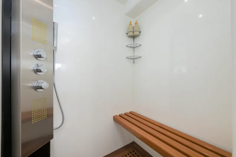  Yacht Photos Pics Shower area in 1999 Falcon Yachts 86 with wooden bench and modern fixtures.