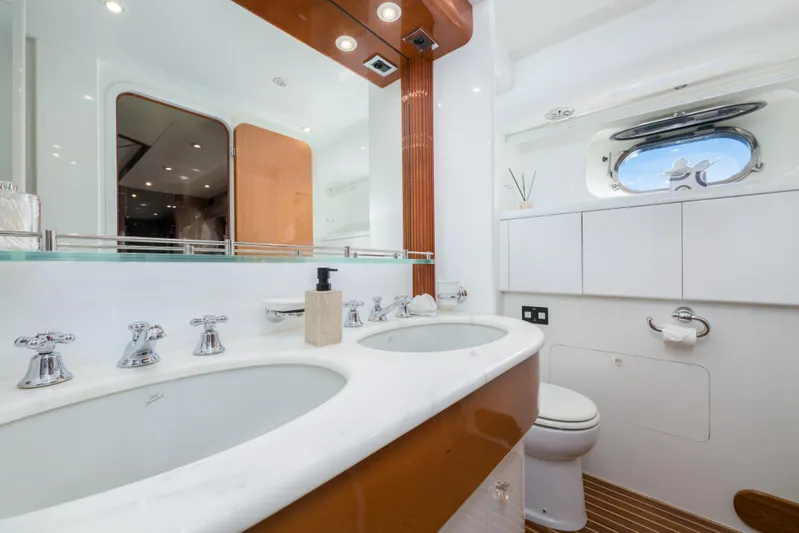  Yacht Photos Pics Luxurious bathroom on 1999 Falcon Yachts 86, featuring dual sinks and modern fixtures.