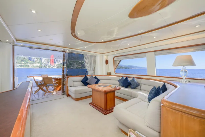  Yacht Photos Pics Luxurious interior of 1999 Falcon Yachts 86 with ocean view and elegant seating.