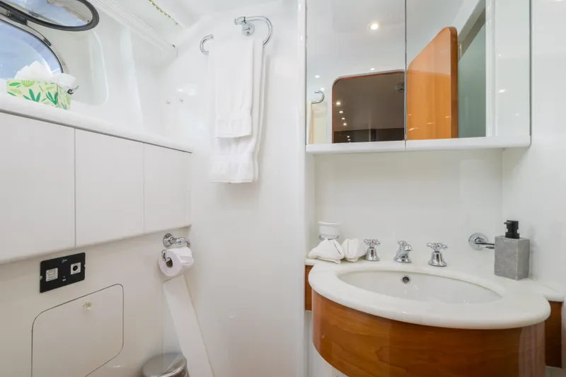  Yacht Photos Pics Luxurious bathroom in 1999 Falcon Yachts 86, featuring elegant fixtures and modern design.