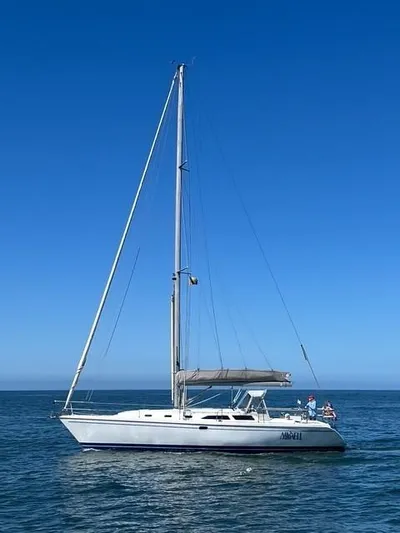 Maxwell Yacht Photos Pics 2001 Catalina 42 MkII sailboat on calm ocean under clear blue sky.