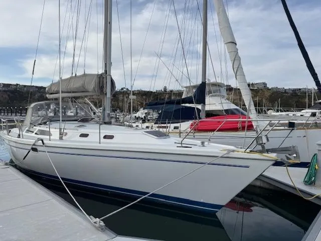 Maxwell Yacht Photos Pics 2001 Catalina 42 MkII sailboat docked in marina, side view.