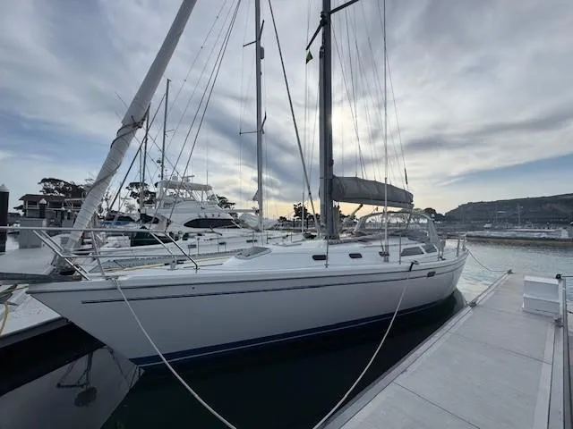 Maxwell Yacht Photos Pics 2001 Catalina 42 MkII sailboat docked at marina under cloudy sky.