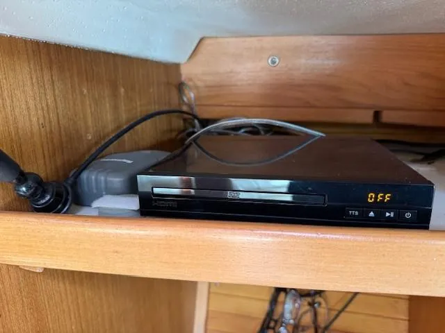 Maxwell Yacht Photos Pics DVD player on a wooden shelf inside a 2001 Catalina 42 MkII yacht.