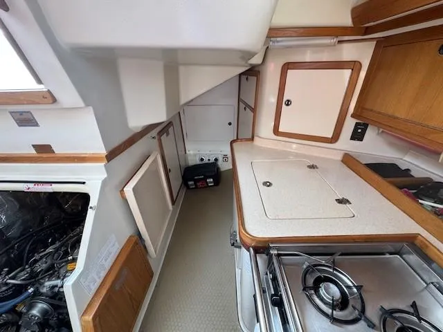 Maxwell Yacht Photos Pics Interior of a 2001 Catalina 42 MkII sailboat, featuring a compact kitchen area.