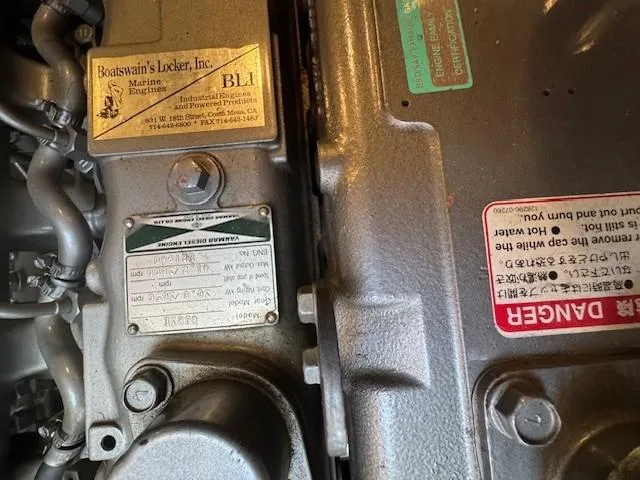 Maxwell Yacht Photos Pics Close-up of a 2001 Catalina 42 MkII engine with warning labels and manufacturer details.