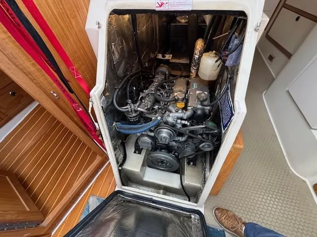 Maxwell Yacht Photos Pics Engine compartment of a 2001 Catalina 42 MkII sailboat, showcasing mechanical details.