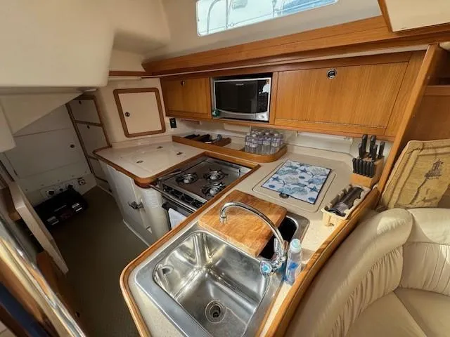 Maxwell Yacht Photos Pics 2001 Catalina 42 MkII yacht kitchen with sink, stove, and microwave.