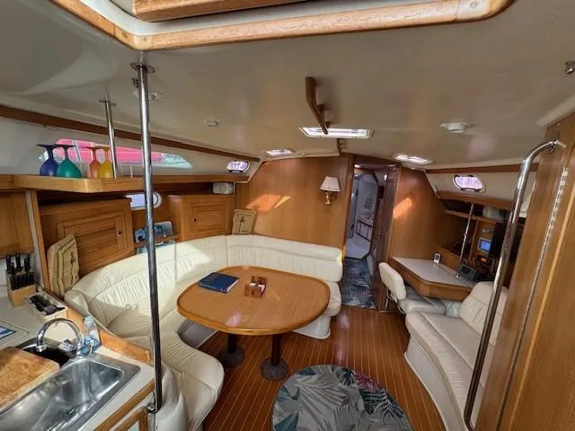 Maxwell Yacht Photos Pics Interior of 2001 Catalina 42 MkII sailboat with wood finish and cozy seating area.