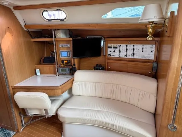 Maxwell Yacht Photos Pics Interior of 2001 Catalina 42 MkII yacht with navigation station and seating area.