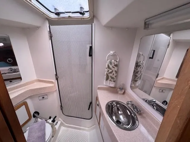 Maxwell Yacht Photos Pics 2001 Catalina 42 MkII yacht bathroom with shower, sink, and mirror.