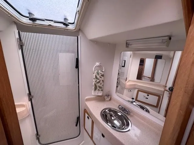 Maxwell Yacht Photos Pics Bathroom interior of 2001 Catalina 42 MkII yacht with sink and shower.