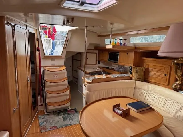 Maxwell Yacht Photos Pics Interior of 2001 Catalina 42 MkII sailboat with cozy seating and wooden finishes.