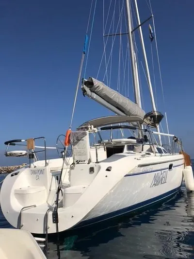 Maxwell Yacht Photos Pics 2001 Catalina 42 MkII sailboat on calm water, clear sky background.