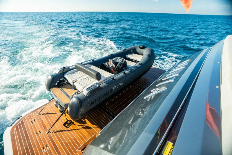 Omnia Yacht Photos Pics Luxury Pearl 80 yacht with inflatable boat on deck, cruising on open sea, 2018 model.