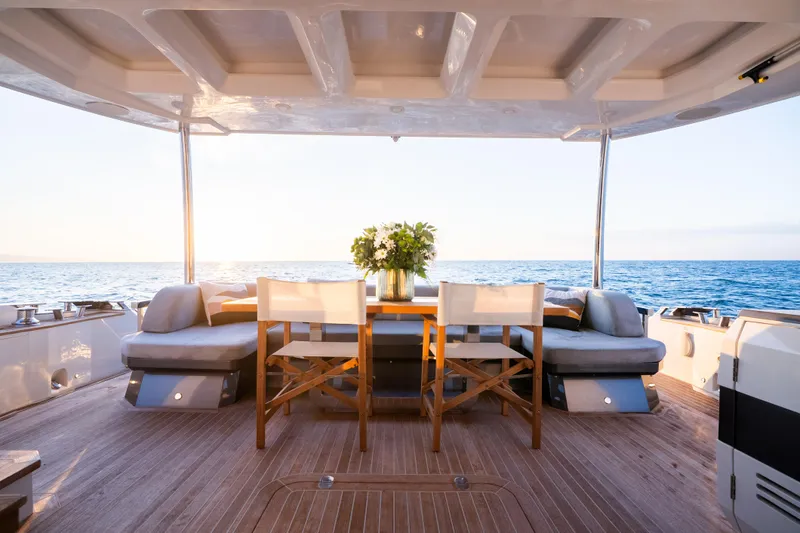 Omnia Yacht Photos Pics Luxurious 2018 Pearl 80 yacht deck with elegant seating and ocean view.