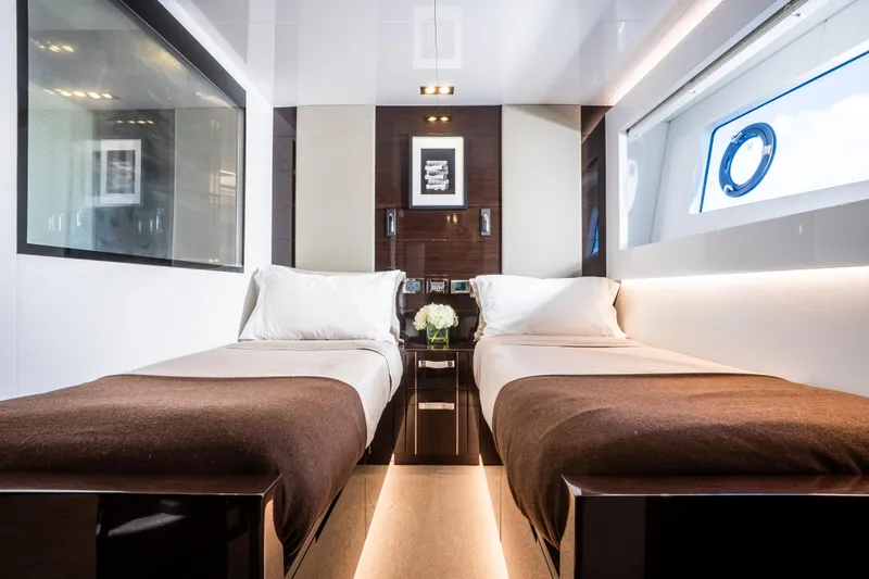 Omnia Yacht Photos Pics Luxurious twin bedroom on 2018 Pearl 80 yacht with modern decor and ocean view.