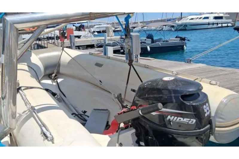 Sunny Days Yacht Photos Pics Inflatable boat with HIDEA outboard motor docked at marina, near Lagoon 380 S2, 2013.